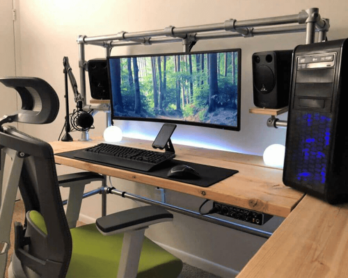 DIY gaming desk made to hold 3 screens